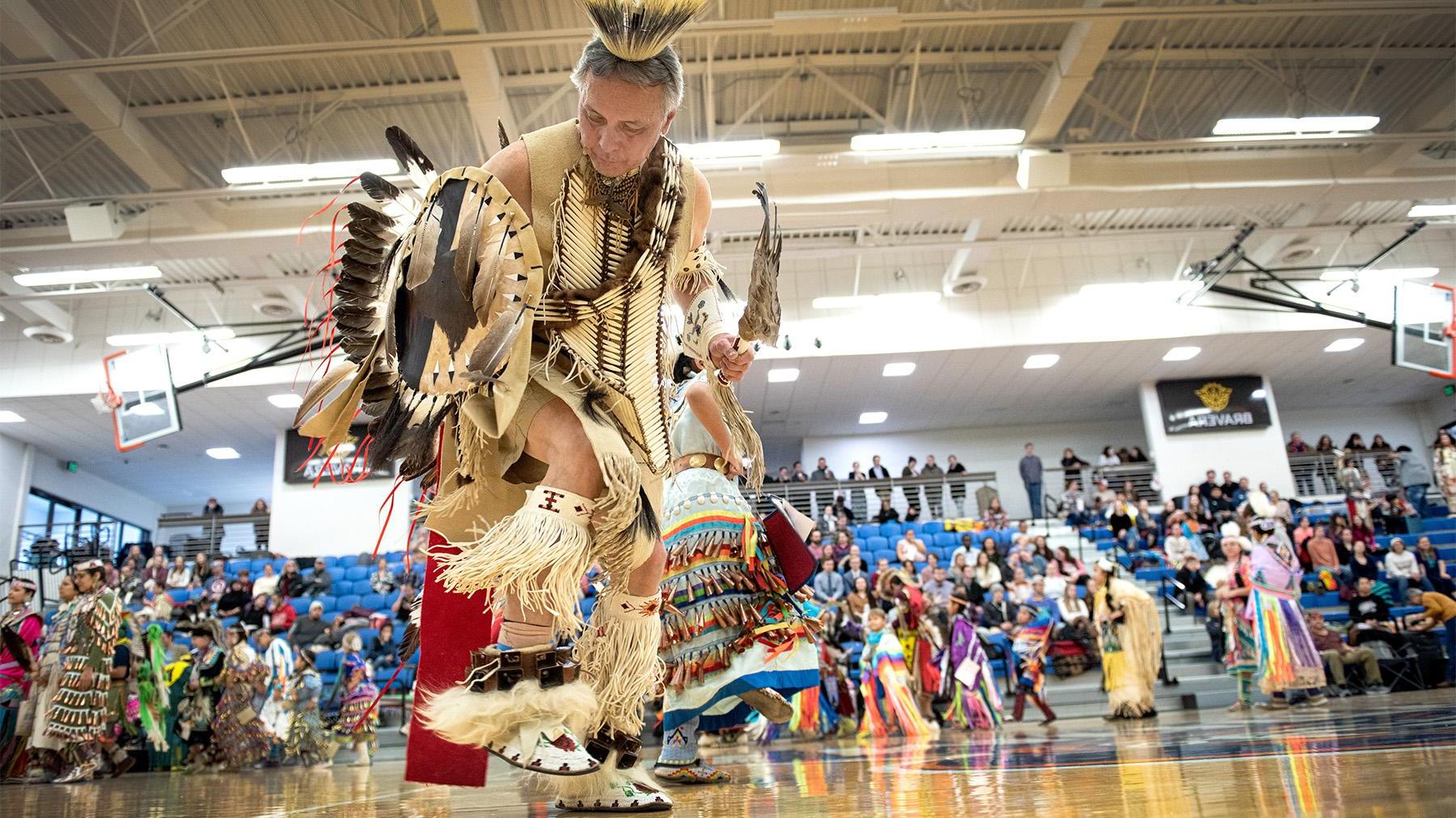 A native American doing a traditional dance